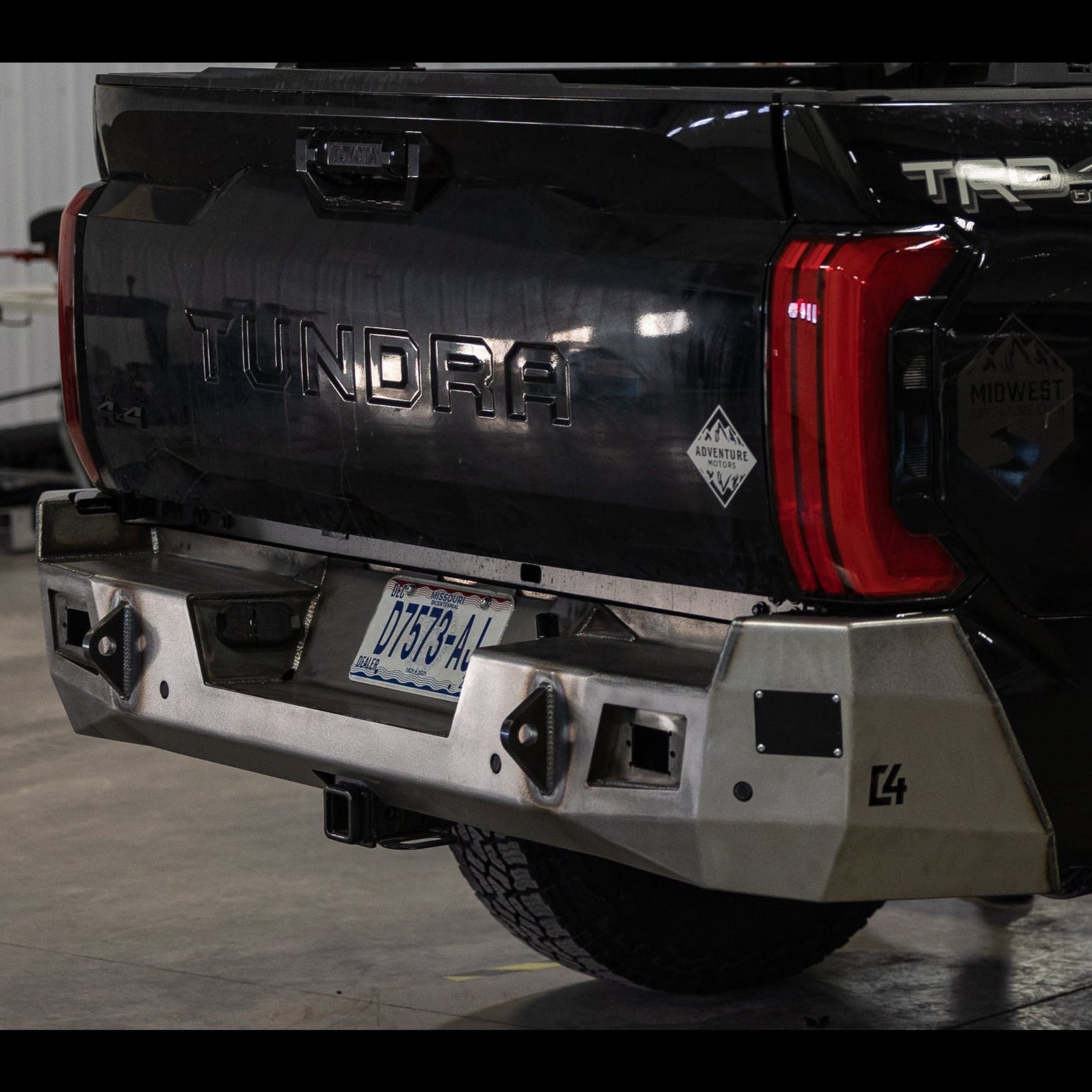 Quartering photo of the C4 Overland rear bumper for 3rd Generation Tundras showing the unfinished form that all C4 bumpers ship to customers in.