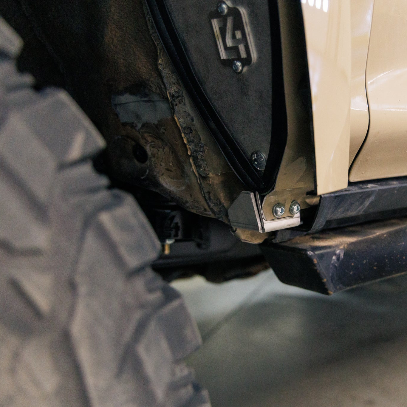 Close-up look at the back of the front wheelwell in a 4Runner that has had C4 Fabrication's Oversized Tire Fitment Kit installed.