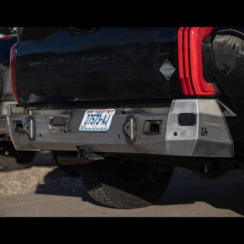 Photo taken from a low angle showing the many facets of the C4 Overland bumper for the 3rd Gen Toyota Tundra, displayed in the raw steel finish that all C4 bumpers ship to customers in.
