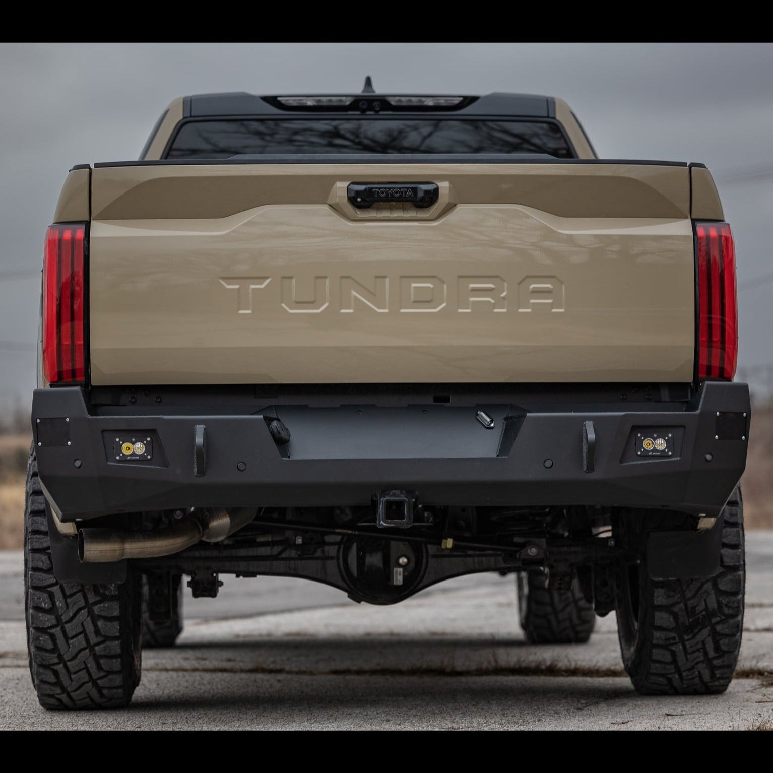 Low angle rear view of the steel C4 Overland bumper for the 2022+ Toyota Tundra.