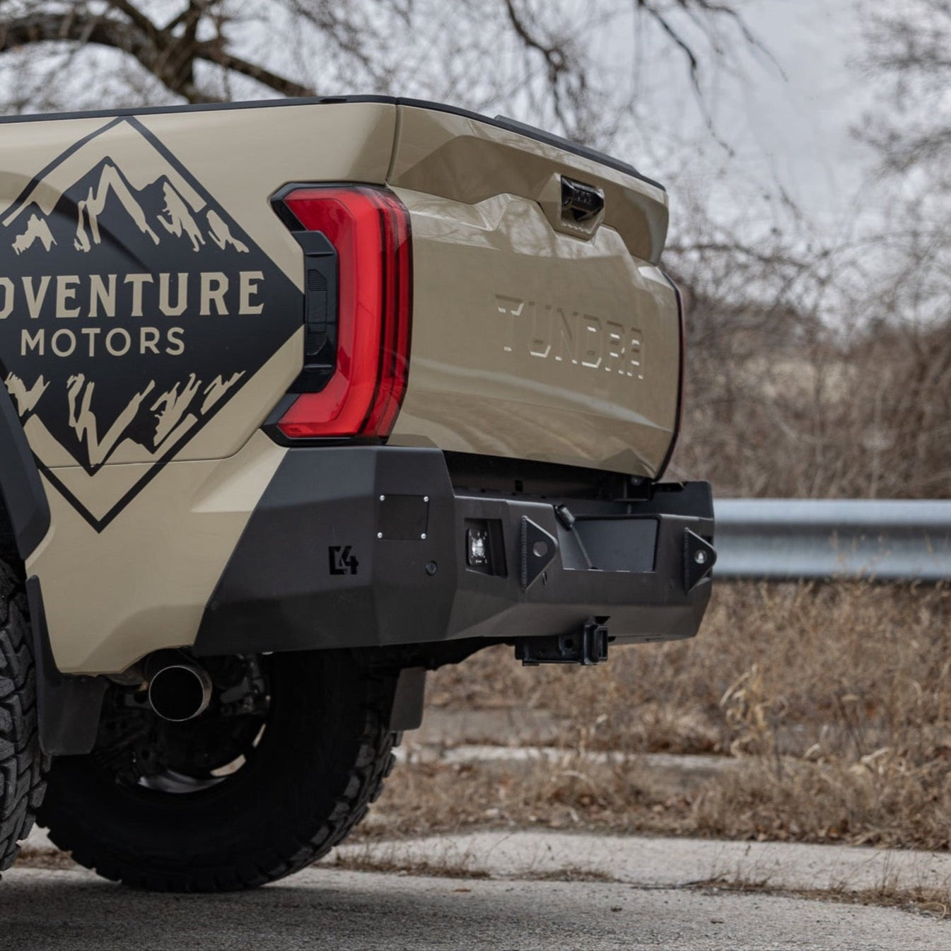 Quartering view of the C4 Overland rear bumper for the 2022+ Toyota Tundra, showing the many angles incorporated into the design that give the bumper a great aesthetic.
