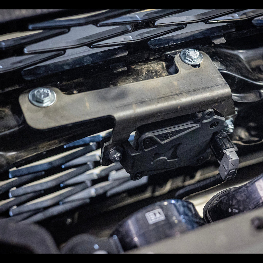 A view from above and behind, showing the properly-installed TSS Relocation Bracket. 