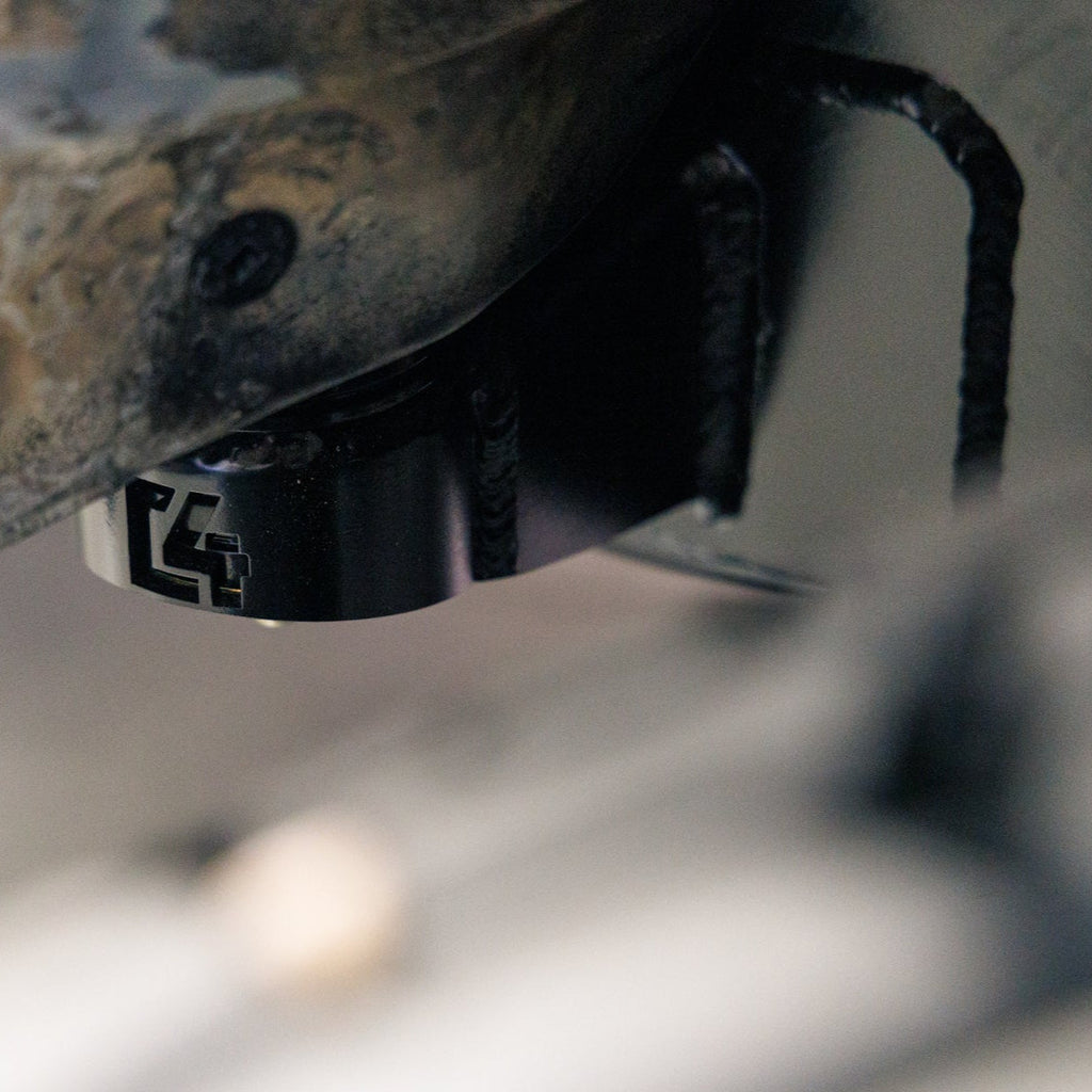 Close-up of installed Body Mount Relocation that is included in the complete C4 Oversized Tire Fitment Kit.