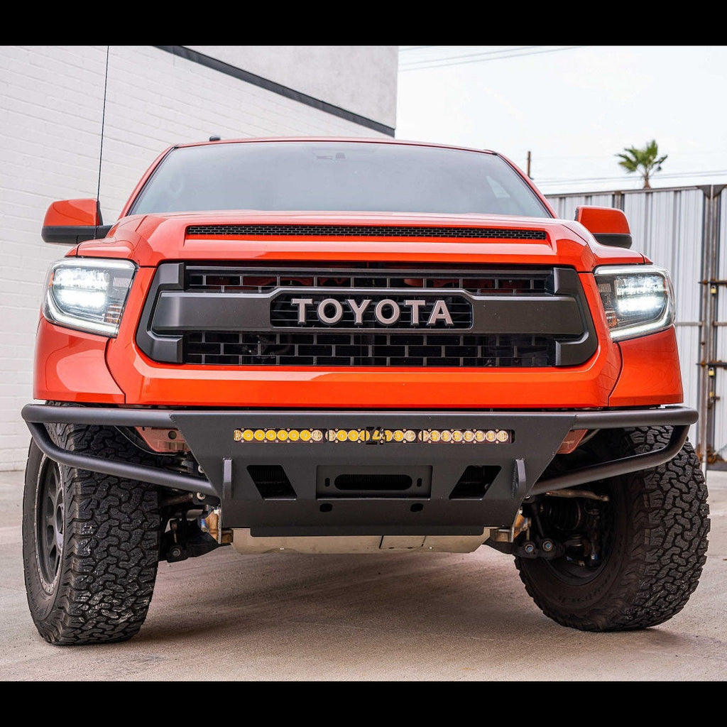 Red Toyota Tundra equipped with a C4 Hybrid bumper.