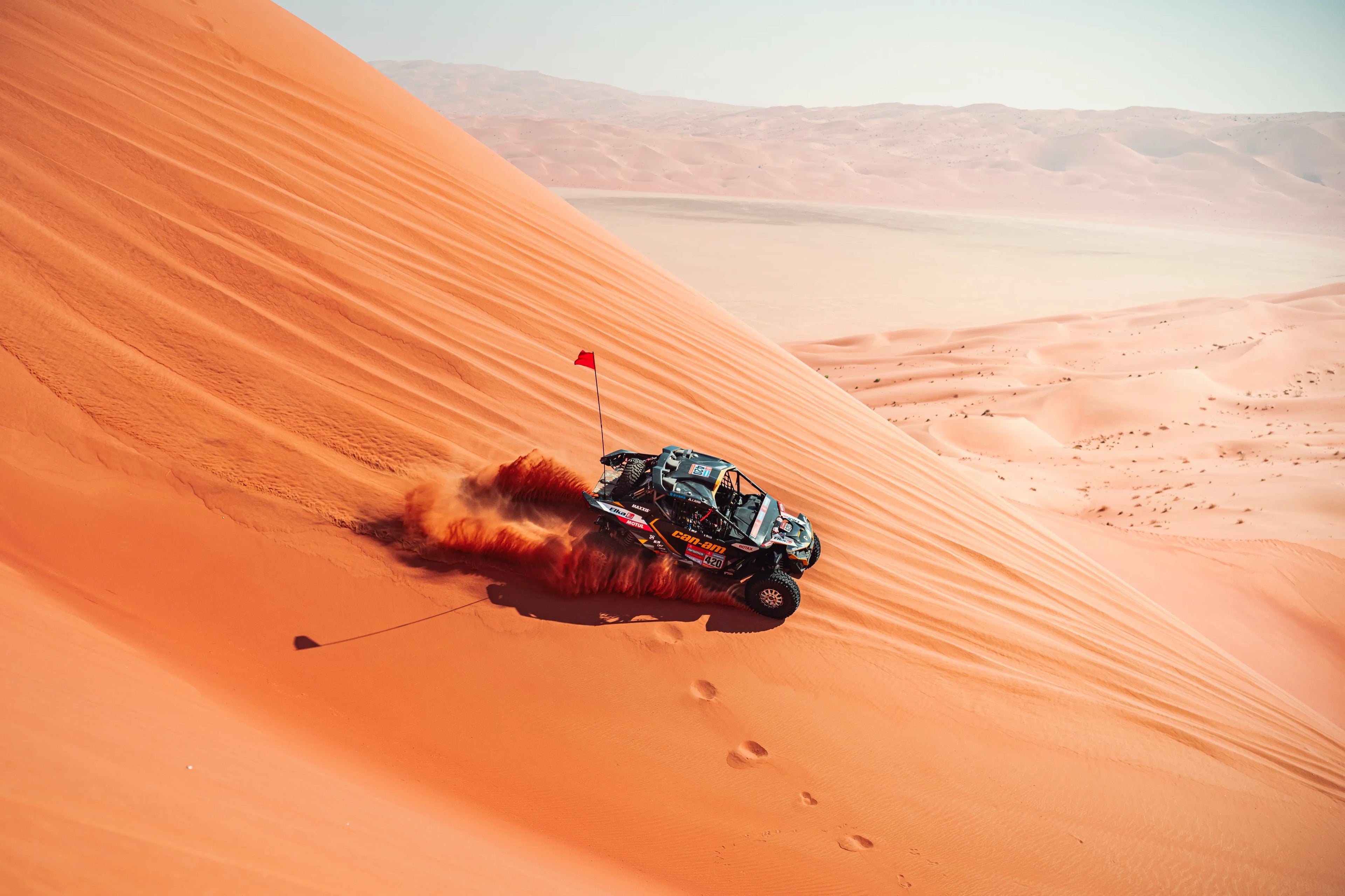 Dune buggy racing down a sand dune, with elka suspension 