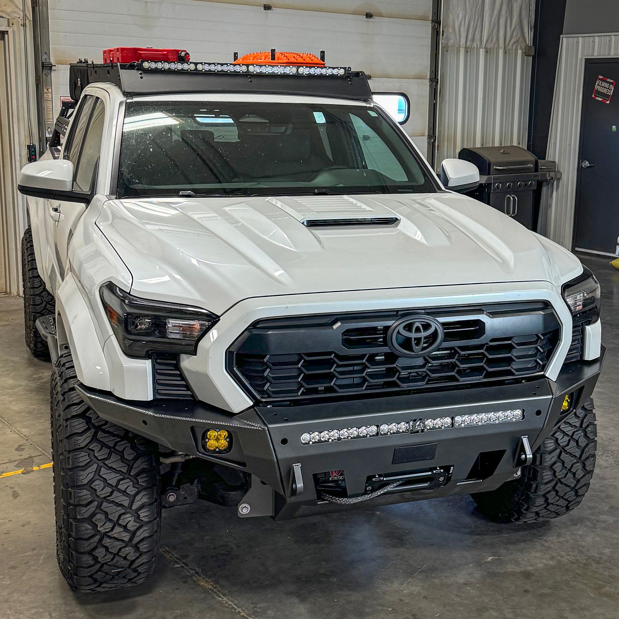 Elevated view of the front end of a 2024 Tacoma equipped with a flat-top Overland bumper from C4, illustrating how tight to the original lines the bumper sits. 