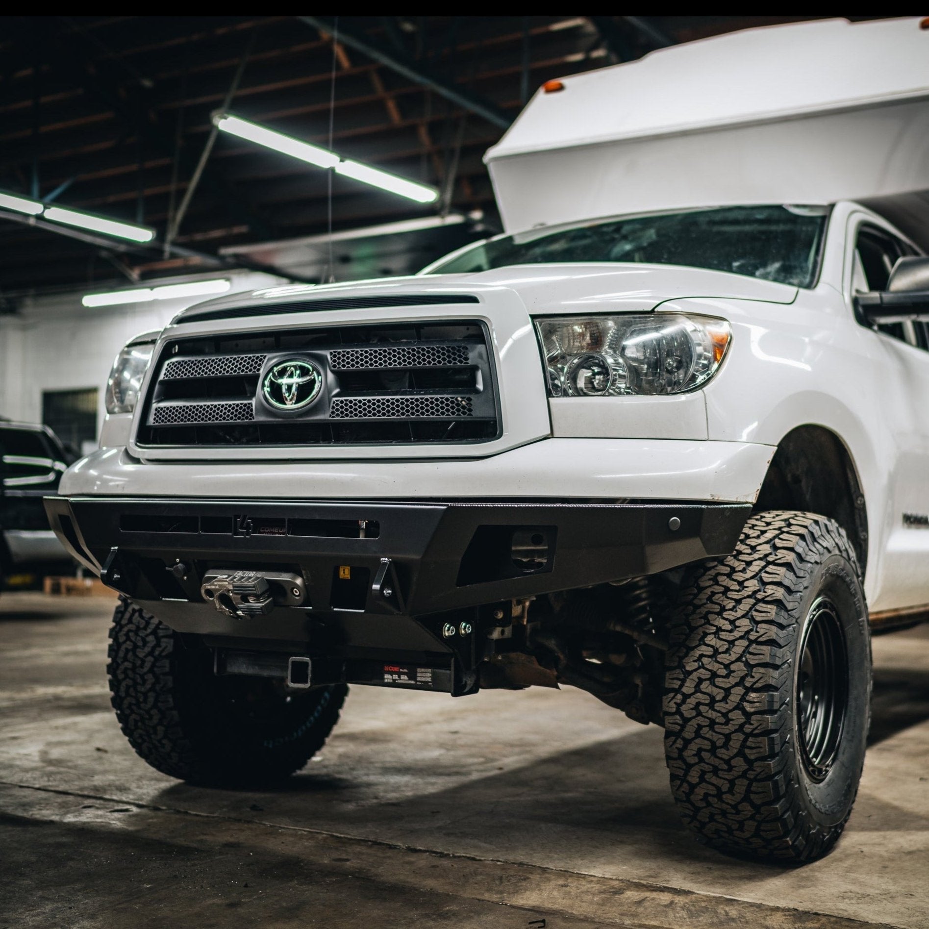 Low angle photo showing the clearance and tow points of the Overland Bumper from C4 for the early second generation Toyota Tundra.