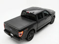 Black pickup truck with a tonneau cover on a white background